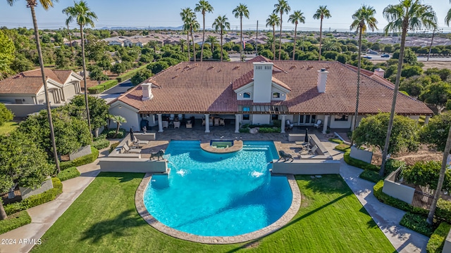 view of swimming pool with a gazebo, a lawn, a patio area, and pool water feature