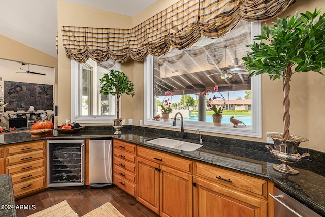 kitchen with wine cooler, plenty of natural light, sink, and dark hardwood / wood-style flooring