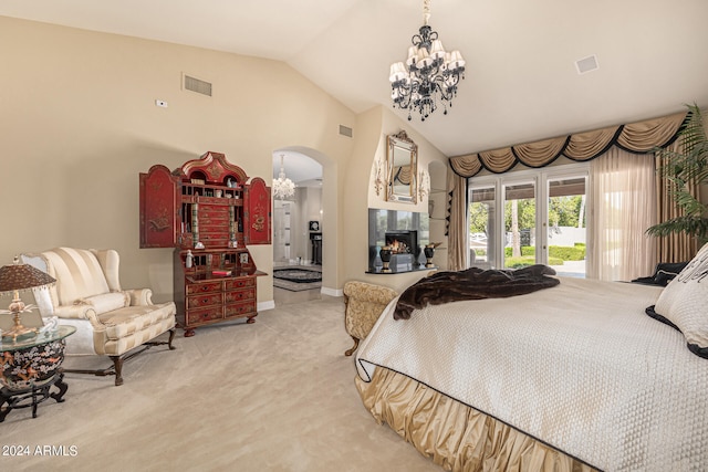 bedroom with light colored carpet, lofted ceiling, and access to exterior