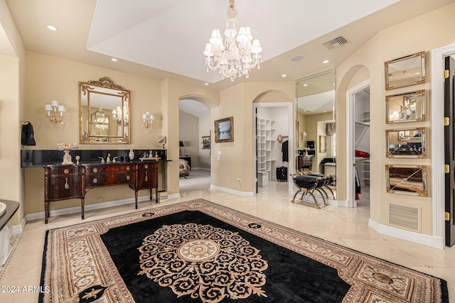 entrance foyer featuring a notable chandelier