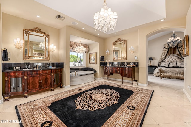 bathroom with vanity, a tub to relax in, and tile patterned flooring