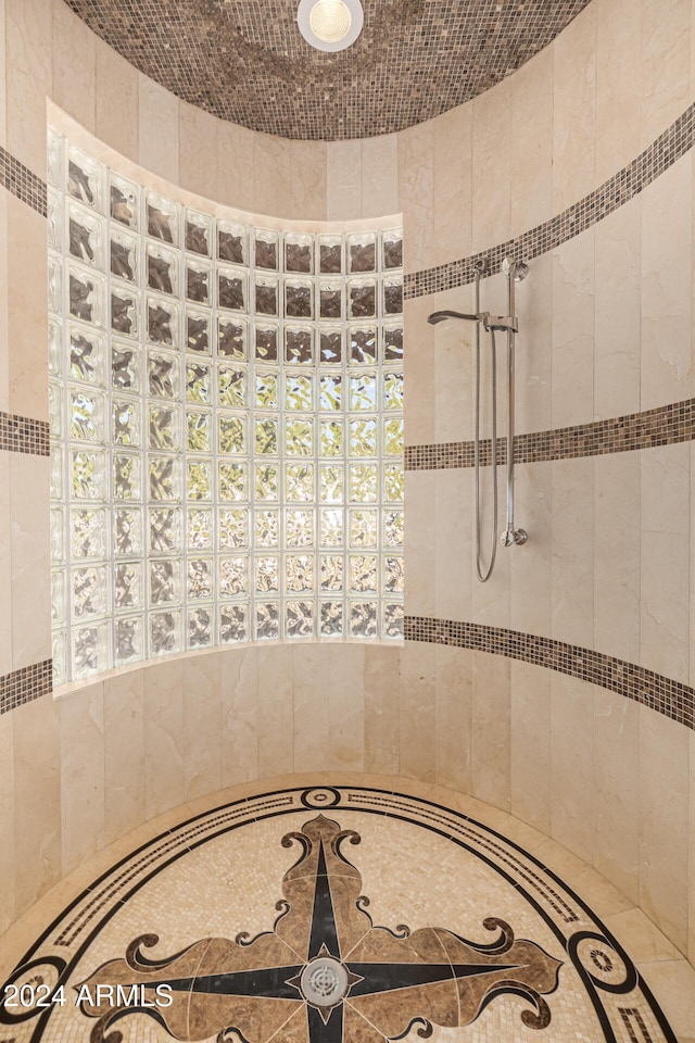 bathroom with tiled shower