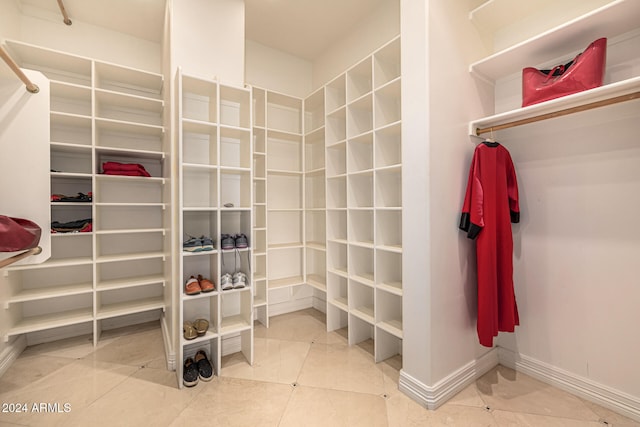 spacious closet featuring tile patterned flooring