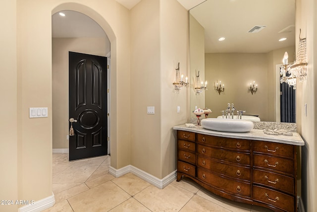 bathroom featuring tile patterned floors and vanity