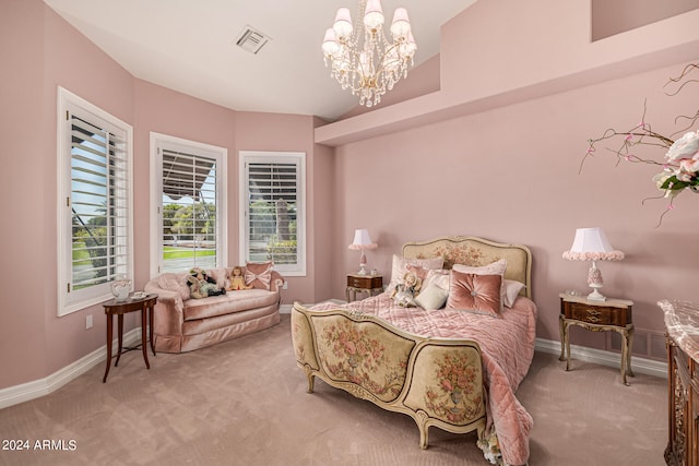 bedroom with a notable chandelier and light colored carpet