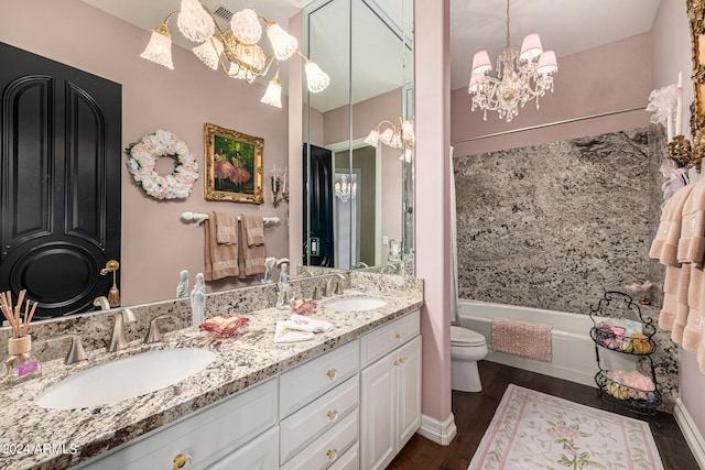 full bathroom with tub / shower combination, vanity, hardwood / wood-style floors, and toilet