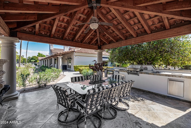 view of patio / terrace with ceiling fan, area for grilling, sink, a gazebo, and exterior kitchen