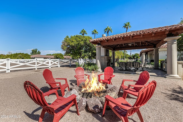 view of patio / terrace featuring a gazebo and a fire pit