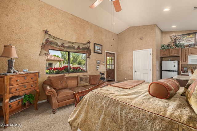 carpeted bedroom featuring stainless steel fridge, ceiling fan, and vaulted ceiling