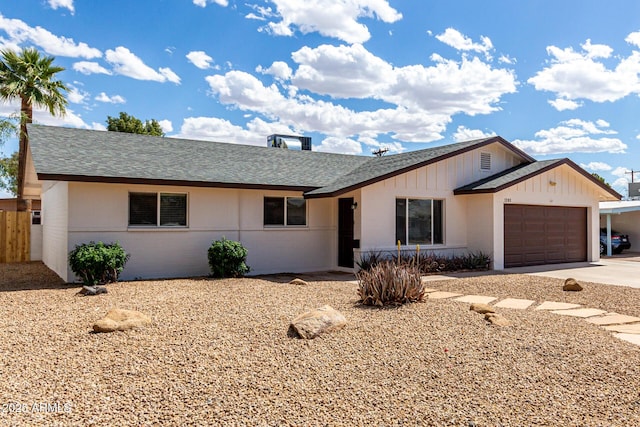 1203 E Bishop Dr, Tempe, AZ 85282 - ranch-style home featuring a garage, fence, roof with shingles, board and batten siding, and driveway