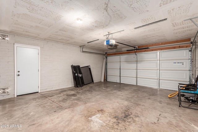 1203 E Bishop Dr, Tempe, AZ 85282 - garage with concrete block wall and a garage door opener