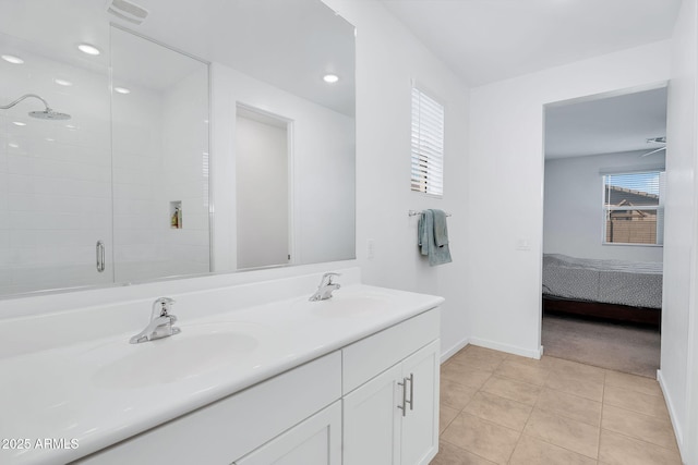22560 E Rosa Rd, Queen Creek, AZ 85142 - bathroom with a shower stall, baseboards, ensuite bathroom, tile patterned flooring, and double vanity