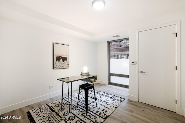 office space with light wood-type flooring