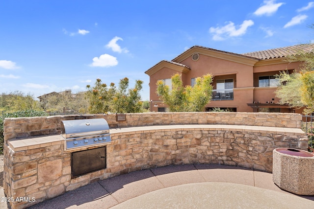 view of patio featuring exterior kitchen and area for grilling
