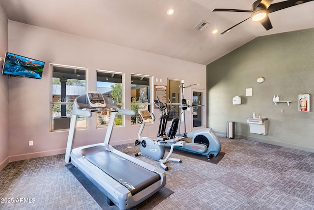 exercise room featuring carpet flooring, a ceiling fan, vaulted ceiling, and baseboards