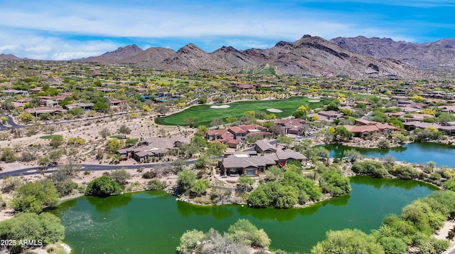 aerial view of property and surrounding area with nearby suburban area, a water and mountain view, and a golf club