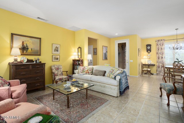 19714 N Concord Dr, Surprise, AZ 85374 - tiled living room with a chandelier and baseboards