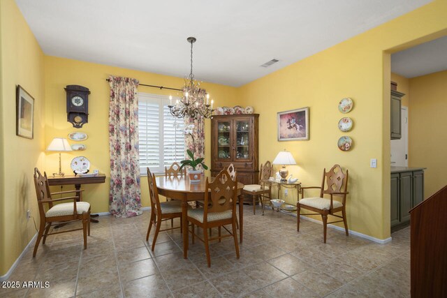 19714 N Concord Dr, Surprise, AZ 85374 - dining area featuring a chandelier and baseboards