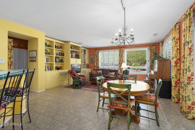 19714 N Concord Dr, Surprise, AZ 85374 - dining area featuring a chandelier, light tile patterned floors, and baseboards
