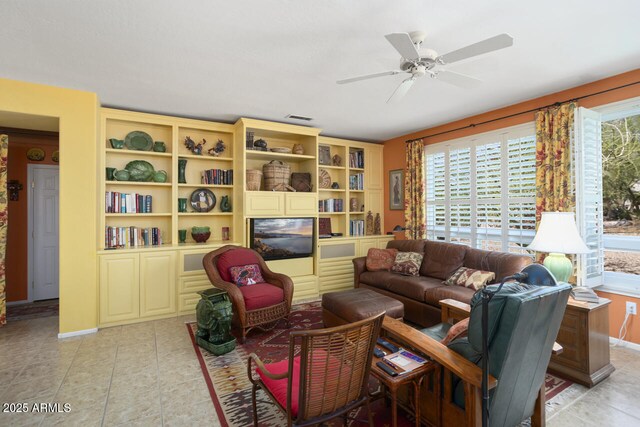 19714 N Concord Dr, Surprise, AZ 85374 - living room featuring ceiling fan, light tile patterned floors, and baseboards