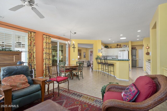 19714 N Concord Dr, Surprise, AZ 85374 - living room featuring a chandelier, ceiling fan, light tile patterned flooring, and recessed lighting