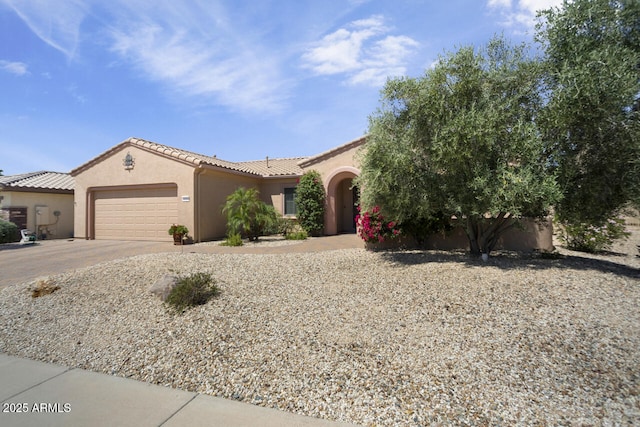 19714 N Concord Dr, Surprise, AZ 85374 - view of front of house featuring a garage, stucco siding, driveway, and a tiled roof