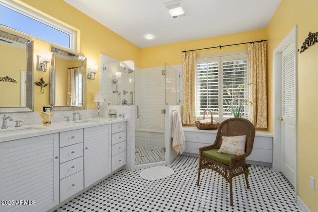 19714 N Concord Dr, Surprise, AZ 85374 - bathroom featuring a shower stall, double vanity, and tile patterned floors