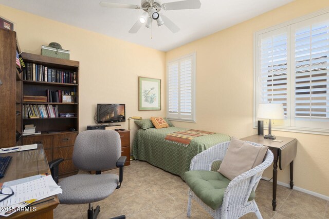19714 N Concord Dr, Surprise, AZ 85374 - tiled bedroom with multiple windows, ceiling fan, and baseboards