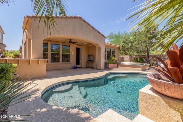 view of pool with a fenced in pool, a ceiling fan, a patio, a fenced backyard, and a jacuzzi