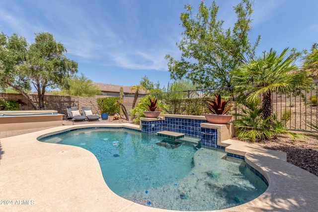 view of pool with a patio, a fenced backyard, a jacuzzi, and a fenced in pool