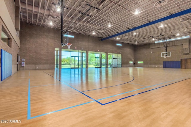 view of basketball court with community basketball court and fence