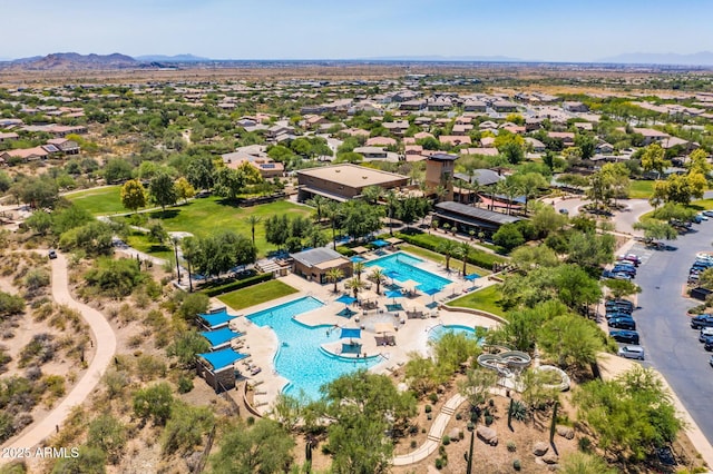 birds eye view of property with a mountain view