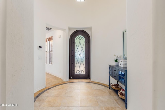 entryway with visible vents and baseboards