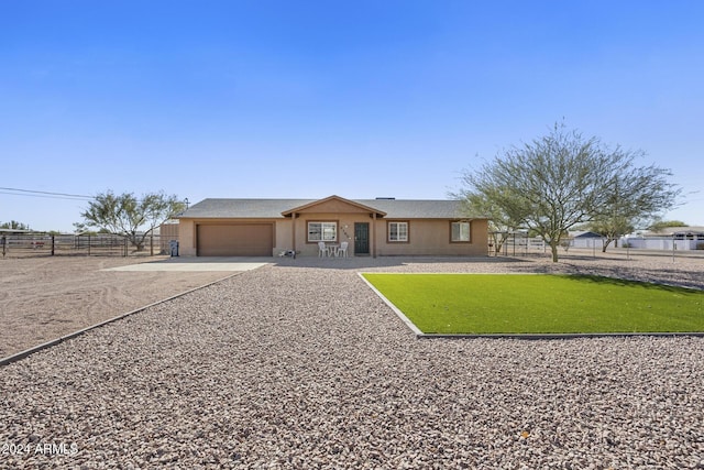 ranch-style home with a garage