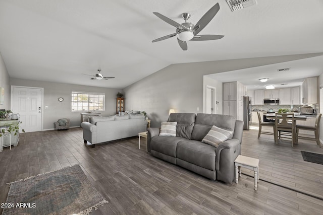 living room with wood-type flooring and lofted ceiling