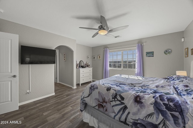 bedroom featuring ceiling fan and dark wood-type flooring