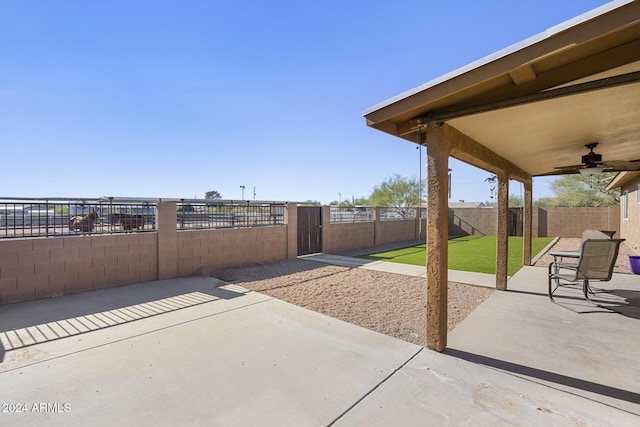 view of patio featuring ceiling fan