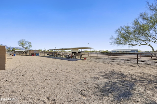 view of property's community with a rural view and an outdoor structure