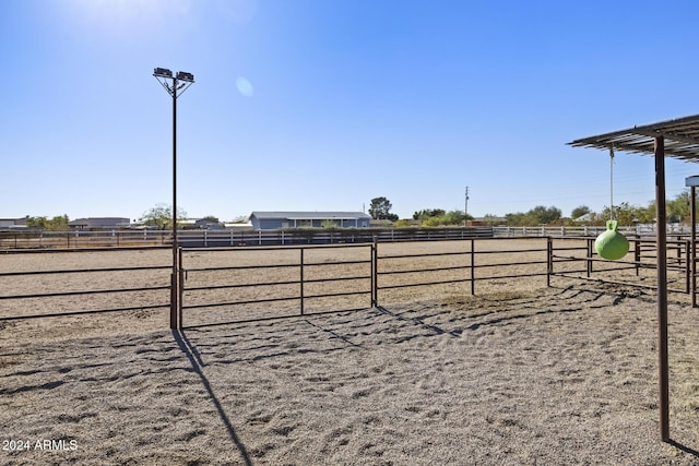 view of yard with a rural view