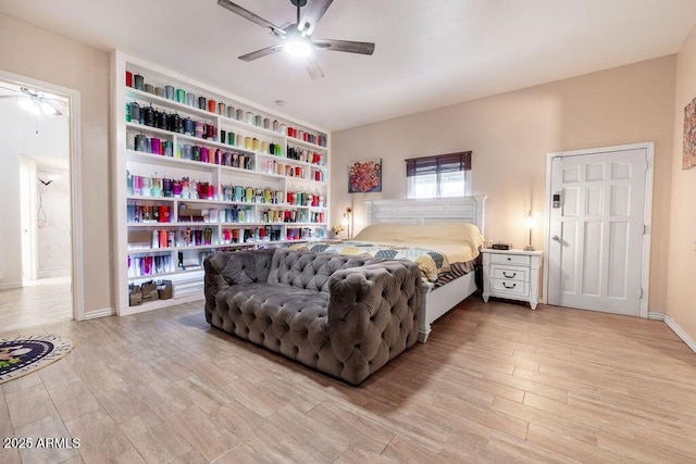 bedroom with ceiling fan and light wood-type flooring