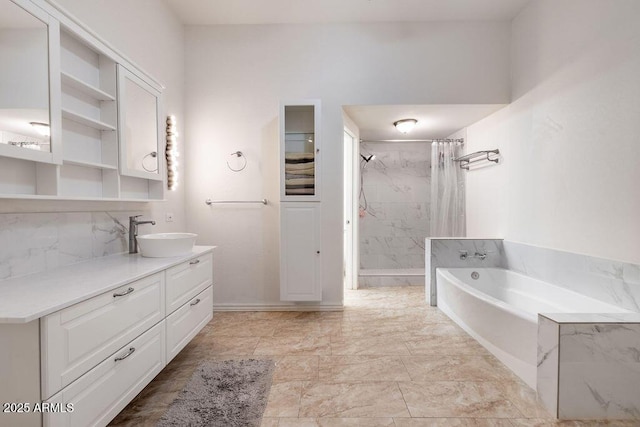 bathroom featuring vanity and separate shower and tub