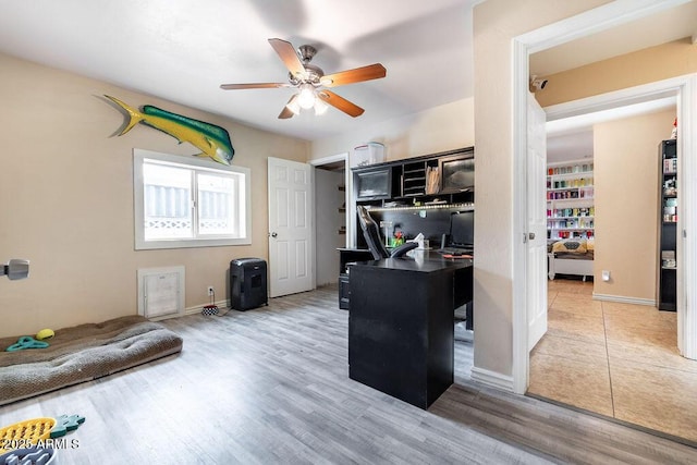 office area with ceiling fan and wood-type flooring