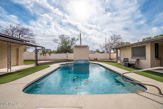 view of pool with a storage shed