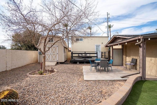 view of yard featuring a shed and a patio