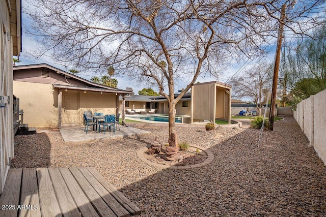 view of yard with a patio and a fenced in pool