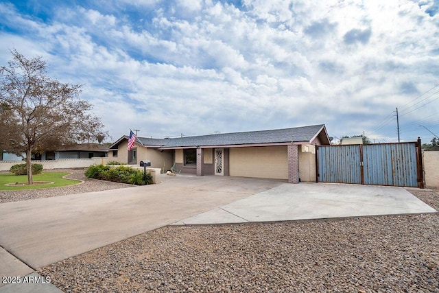 ranch-style home featuring a garage