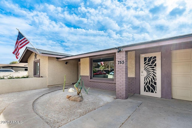 view of front of house with a patio area