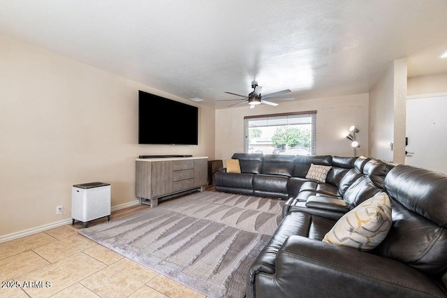 living room with light tile patterned floors and ceiling fan