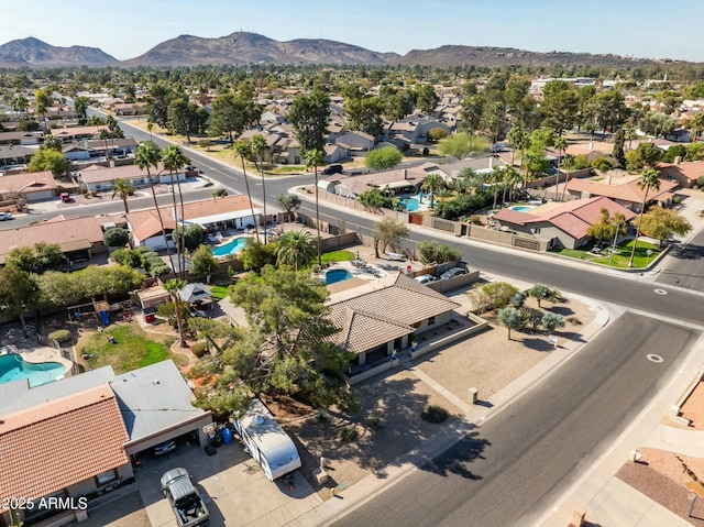 birds eye view of property with a residential view and a mountain view