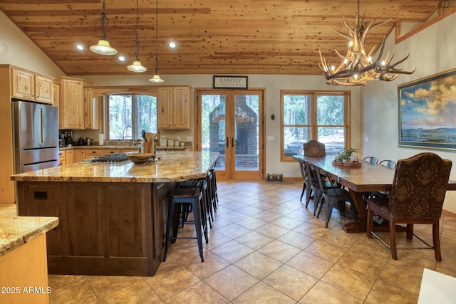 702 Flag Hollow Rd, Pinetop-Lakeside, AZ 85929 - kitchen featuring wooden ceiling, appliances with stainless steel finishes, light brown cabinets, a chandelier, and light tile patterned floors